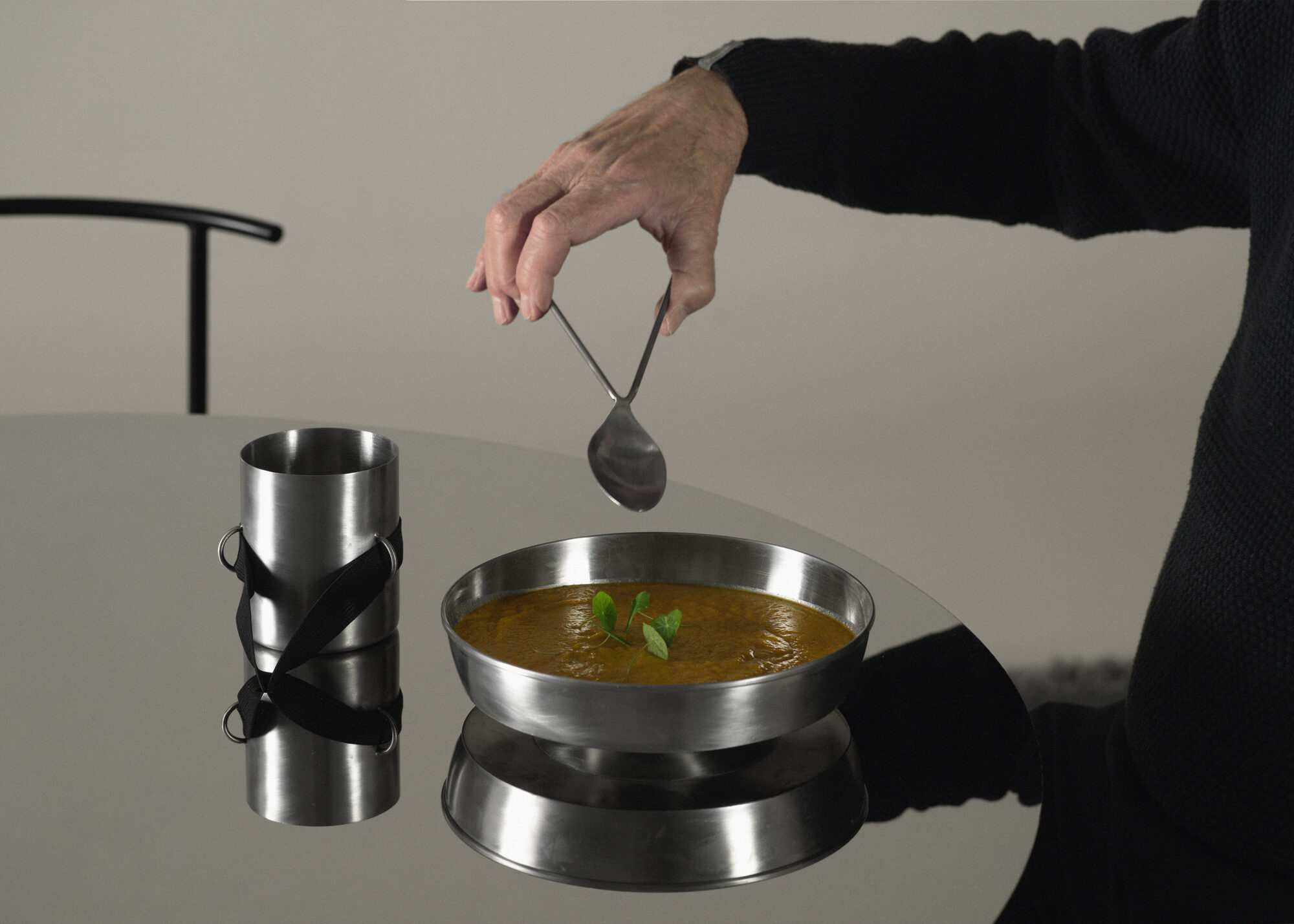 Tavola Distorta — serving soup with the designed spoon
